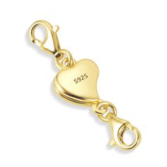 a gold key chain with a heart on it