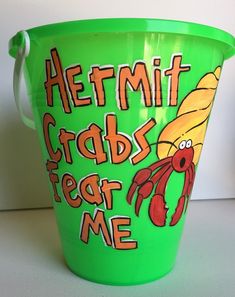 a green bucket with an image of a crab and corn on the cob in it