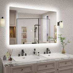 a bathroom with two sinks and a large mirror