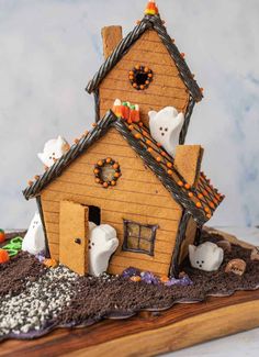 a gingerbread house decorated with spooky decorations