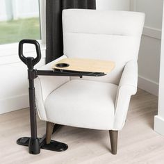 The Stander TV Tray Table combines convenience with safety. It has a wooden table top with a built-in cup holder and utensil compartment. This multi-purpose dinner tray is perfect for working from home, eating meals, or enjoying a book. The 16" x 18" bamboo table can support up to 30 pounds. When not in use, you can pivot the tabletop and use it as a side table. The safety assist handle offers leverage and support when sitting or standing from a couch, lift chair, or recliner. It's designed to b Swivel Tv, Tv Tray Table, Tv Tray, Tv Trays, Bamboo Table, Cane Chair, Wooden Table Top, Independent Living, Mobility Aids