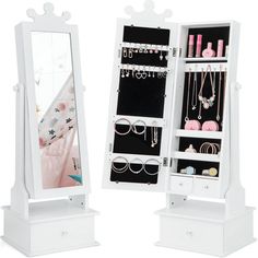 a white jewelry cabinet with two mirrors on it