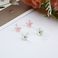 **Butterfly Earrings** Mateiral: Resin -Package: 1 Pair+Gift Box ♡Notes 1. The daily maintenance of jewelry is very important. Whether it is S925 silver or alloy material, the degree of discoloration is closely related to your usage. If the product is not to be used for a short period of time, it can be placed in a storage box. ! ! Try to avoid contact with chemical substances! ! 2. Due to manual measurement, the product will have a little error, please understand. 3. The color of the product under different light will be slightly different, but we can guarantee that the difference will not be so exaggerated that it makes you think that these are two products. 4. If the product has quality problems, please contact me immediately after receiving the goods, and I will try to help you deal wi Cute Butterfly Jewelry For Pierced Ears, Delicate Butterfly Earrings Gift, Tiny Butterfly Dainty Earrings, Tiny Dainty Butterfly Earrings, Dainty Tiny Butterfly Earrings, Whimsical White Butterfly Jewelry, Cute Butterfly Earrings For Gift, White Dainty Butterfly Earrings, Dainty White Butterfly Earrings