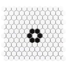 a white and black hexagonal tile pattern with an eight - sided design in the center