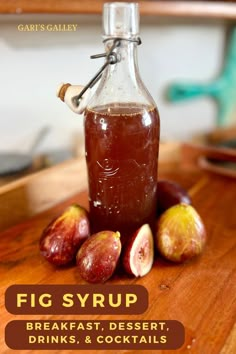 fig syrup in a glass bottle surrounded by figs on a wooden cutting board with the words fig syrup breakfast dessert drinks and cocktails