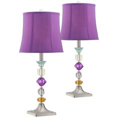 two lamps with purple shades on them