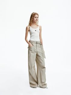 MO&Co. Women's Straight Leg Cargo Pants Elevate your casual style with our pants. Crafted from a comfy cotton blend, these pants offer a relaxed fit and wide legs that will pool effortlessly over your shoes. The folded details at the knee add a touch of industrial chic. Perfectly pairs with a fitted top for a laid-back yet trendy look. Features : - Relaxed fit, wide leg, full length- Knee pleated design, including belt- Multi cargo pockets and flap pocket at the back Code: MBD1PATT07The back len Straight Leg Cargo Pants, Fitted Top, Industrial Chic, Wide Legs, Flap Pocket, Cargo Pants, The Knee, Black Pants, Casual Style