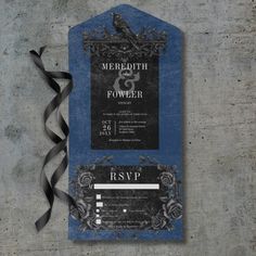 a blue and black wedding card with a bird on it next to a gray ribbon