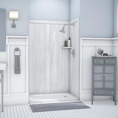 a bathroom with blue walls and white fixtures