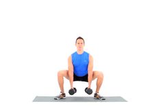 a man squats down with two dumbbells on his knees and one leg behind him