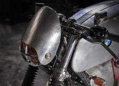 a close up view of a motorcycle's headlight and handlebars on it