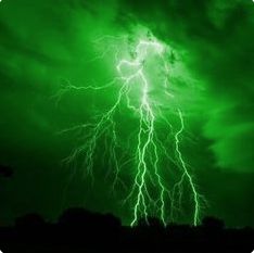 a green and black photo of a lightning storm