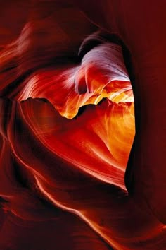 an abstract image of the inside of a canyon with red and orange colors on it