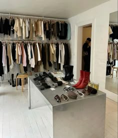 a room filled with lots of clothes and shoes