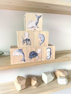 wooden blocks with animals and sea creatures on them