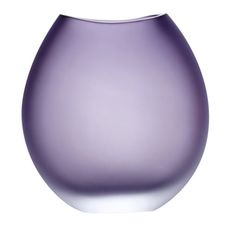 a purple vase sitting on top of a white table