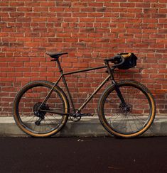 a bike leaning against a brick wall