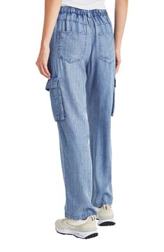 Lightweight chambray pants feature a comfortable elastic waist, wide legs and trendy cargo pockets for a look you'll love. 31 1/2" inseam; 9" leg opening; 10" front rise; 13 1/2" back rise Zip fly with button closure; elastic waist Five-pocket style; cargo flap-patch pockets 100% lyocell Machine wash, tumble dry Imported Relaxed Fit Wide Leg Bottoms With Multiple Pockets, Light Wash Casual Cargo Pants With Pockets, Casual Light Wash Cargo Pants With Pockets, Casual Mid-rise Cargo Pants With Elastic Waistband, Linen Cargo-style Bottoms, Relaxed Fit Linen Cargo Bottoms, Relaxed Fit Linen Cargo Style Bottoms, Relaxed Fit Wide Leg Bottoms With Cargo Pockets, Wide Leg Bottoms With Cargo Pockets And Relaxed Fit