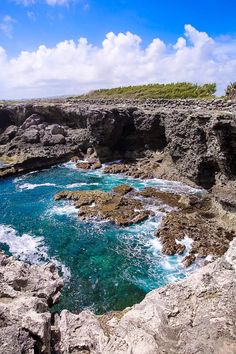 the water is blue and green in this rocky area