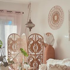 a living room filled with lots of furniture and decor on top of a wooden table