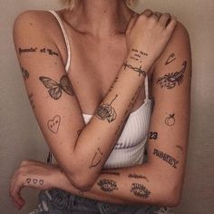 a woman with many tattoos on her arms