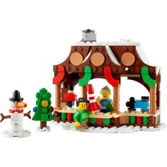 a lego christmas scene with snowmen and a gazebo