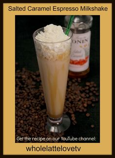 a tall glass filled with ice cream and coffee beans