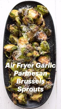 air fryer garlic parmesan brussel sprouts on a black plate