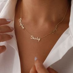 Keep the names of your family members close to your heart with the perfect design. You can choose it for a night out or for daily use.Personalized Multi-Name Necklace,Family Name Necklace S H O W ∙ Y O U R ∙ S T Y L E 𝒰 𝒩 𝐼 𝒬 𝒰 𝐸 ♥ Customize your jewelry only for yourself and create your design. Wear it either for everyday use or for special occasions. 𝒫 𝐸 𝑅 𝐹 𝐸 𝒞 𝒯 ∙ 𝒢 𝐼 𝐹 𝒯 ♥ Make your friends or family happy with this exclusive gift. 𝑀 𝐼 𝒩 𝐼 𝑀 𝒜 𝐿 𝐼 𝒮 𝒯 ∙ 𝒟 𝐸 𝒮 ? Memory Jewelry, Necklace Family, Grandma Names, Handwriting Gifts, Family Jewelry, Family Jewellery, Gold Name Necklace, Gift For Grandma, Custom Name Necklace