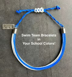 a blue and white bracelet with the words swim team bracelets in your school colors