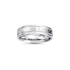 a white gold wedding ring with engraving on the inside and outside, set in 18k white gold