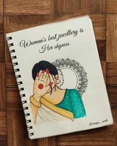 a woman's best - jewelry is her shyness book on a wooden surface