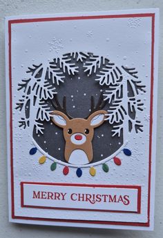 a christmas card with a reindeer head and snowflakes on the bottom, in front of a white background