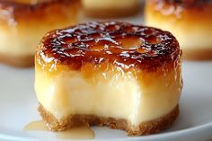 small cheesecakes with caramel sauce on a plate