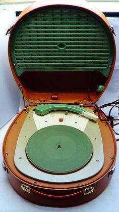 an old record player is open and ready to be used as a projector or display