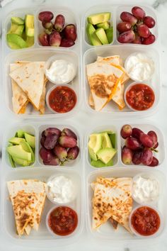 six plastic containers filled with different types of food and fruit on top of a marble table