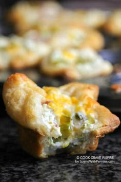 a close up of some food on a table with muffins in the background