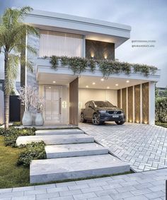 a car is parked in front of a house with steps leading up to the garage