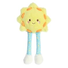 a yellow stuffed animal with stars on it's legs and feet, wearing blue leggings