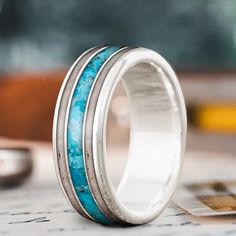 a wedding band with turquoise stone inlays