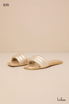 Keep it simple but make it luxe with the Lulus Ameeria Champagne Flat Slide Sandals! These must-have sandals have a shiny, faux leather construction that shapes a square footbed and a wide vamp strap with a puffy, quilted-like effect. The simple slide-on design makes for an effortless final finish to your OOTDs! 0. 5" rubber heel. Cushioned insole. Rubber sole has nonskid markings. Man made materials. Imported. Lulus | Ameeria Champagne Flat Slide Sandal Heels. Sleek Gold Sandals For Summer, Chic Flat Sandals With Padded Heel, Chic Sandals With Cushioned Footbed And Square Toe, Chic Gold Sandals With Textured Footbed, Simple Sandals, Sandals Flat, Sandal Heels, Keep It Simple, Rubber Heels