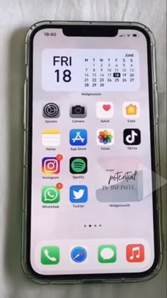 an iphone is shown with the calendar displayed on its display screen, and it's back side