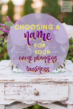 a white table with flowers and the words choosing a name for your event planning business