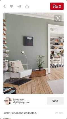 a living room filled with furniture and a clock on the wall