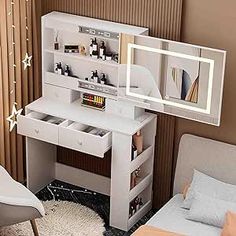 a bedroom with a bed, desk and mirror on the wall next to each other