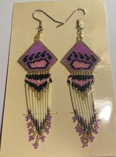 Handmade bearpaw beaded earrings with porcupine quills Bear Paw Earrings, Stitch Bear, Paw Earrings, Porcupine Quills, Chore Charts, Bear Paw, Beadwork Patterns, Bear Paws, Chore Chart