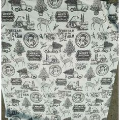 the back of a shirt with christmas farm images on it and trees, cars, trucks, and deer