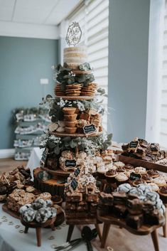 a table topped with lots of cookies and pastries