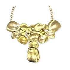 Vintage brutalist style bib necklace by designer Kenneth J Lane. Statement necklace features large interconnecting flat discs of hammered gold plated metal. It has a plated open link chain with large hook closure. The necklace is deadstock and had its original hangtag and price of $150. Unworn condition. Note that the necklace was hand crafted and does show slight variation in color, bubbles and marks in the plating. This is consistent with the piece and should not be considered flaws. Please se Gold-tone Hammered Metal Necklace, Hammered Gold Metal Necklaces, Gold Hammered Metal Necklaces, Gold Hammered Metal Necklace, Metal Bib Necklace With Adjustable Chain, Gold Metal Bib Necklace With Adjustable Chain, Modern Hammered Metal Necklace, Gold Metal Bib Necklace, Purple Party