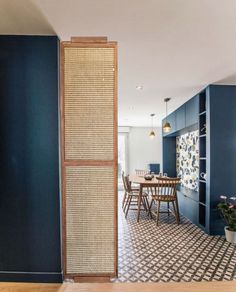 a room divider in the middle of a kitchen with blue walls and flooring